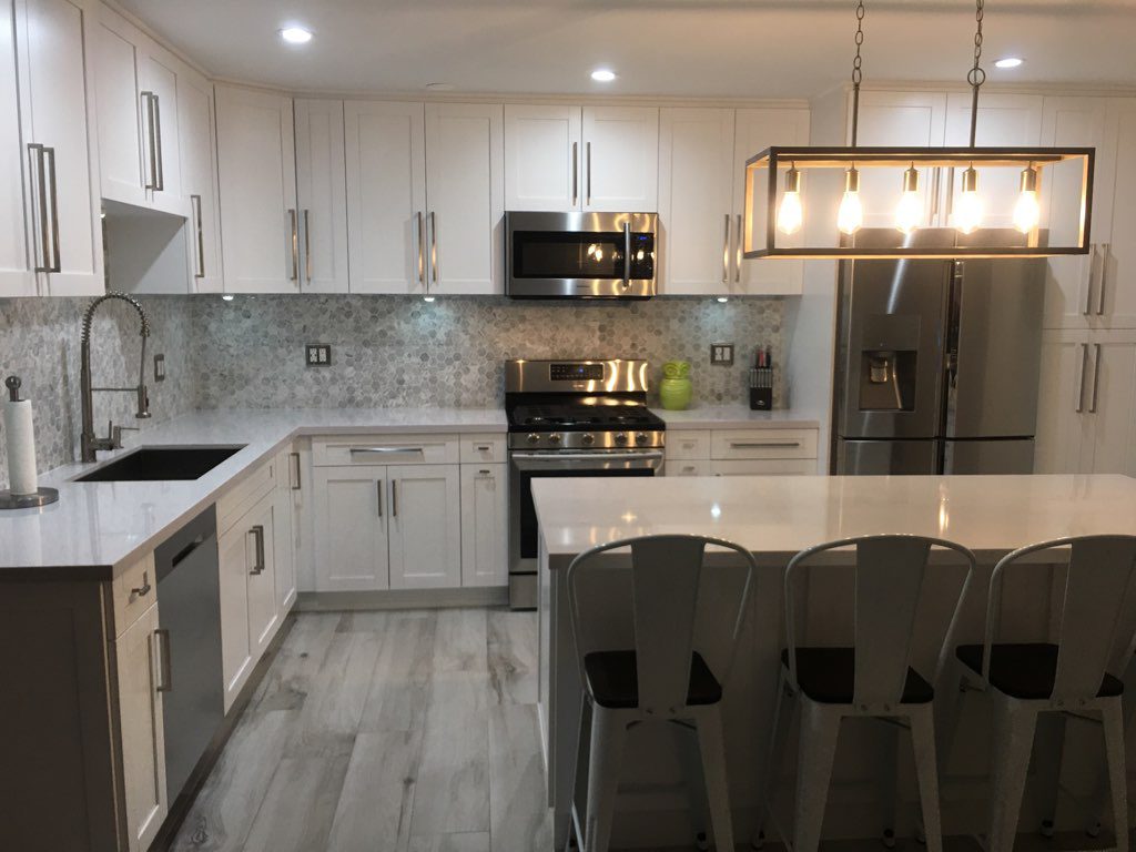 Bright and spacious white kitchen with modern accessories | Sun Control Aluminum & Remodeling