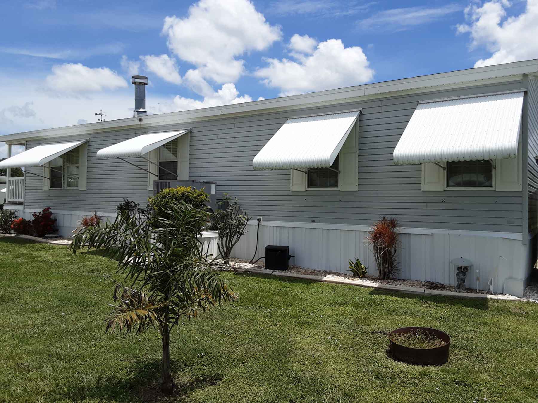 Hurricane Shutters And Clamshell Awnings Sun Control 